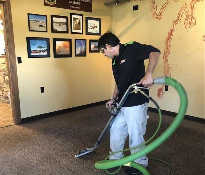 Here to Help - image of technician cleaning